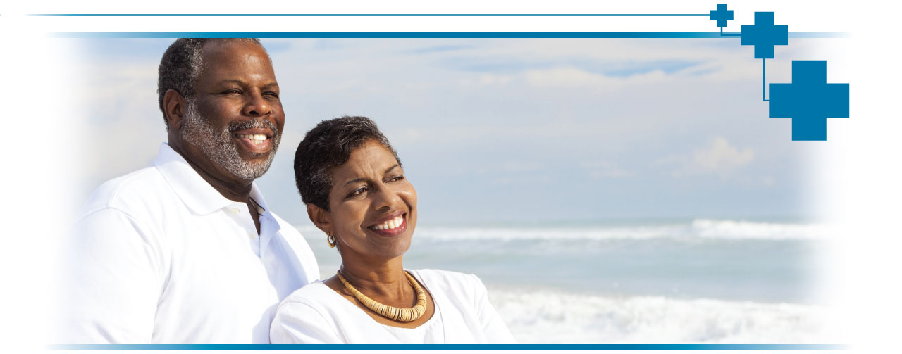 Elderly couple smiling while enjoying a view