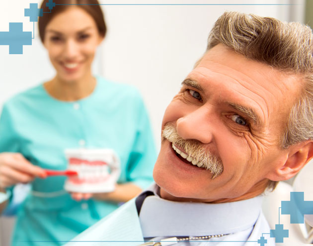 Senior man getting his teeth cleaned