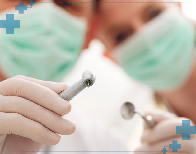 Dentist and Hygienist cleaning teeth